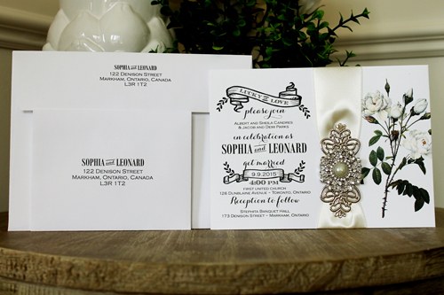Invitation 1331: White Smooth, Antique Ribbon, Brooch/Buckle Q, Metal Filigree F4 - Silver - Flower printed white paper with a neutral ribbon and brooch design