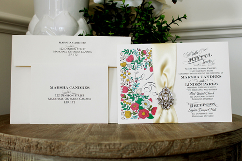 Invitation 1335: Cream Smooth, Buttermilk Ribbon, Brooch/Buckle A17 - Floral Printed Pattern on the card with a buttermilk ribbon and brooch