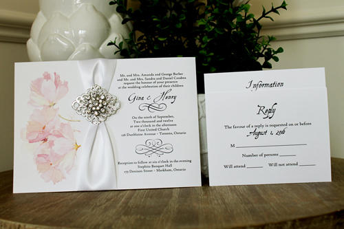 Invitation 1343: White Smooth, Brooch/Buckle A9, Metal Filigree F2 - Silver - Floral design printed on the white card with a white ribbon and rhinestone brooch design