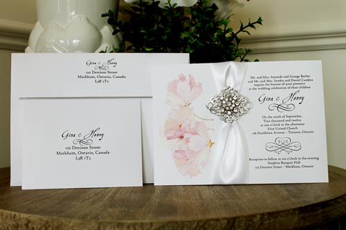 Invitation 1343: White Smooth, Brooch/Buckle A9, Metal Filigree F2 - Silver - Floral design printed on the white card with a white ribbon and rhinestone brooch design