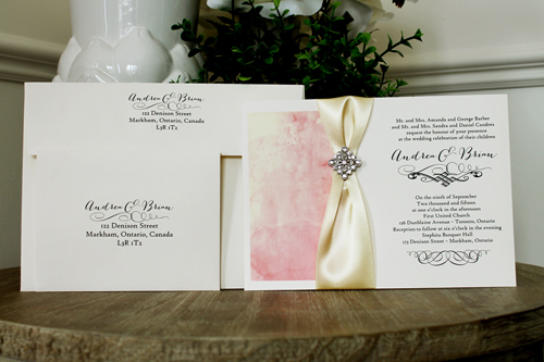 Invitation 1347: Cream Smooth, Buttermilk Ribbon, Brooch/Buckle A22 - Pink watercolor design printed on the cream card with a buttermilk ribbon and diamond shape brooch