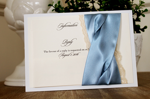 Invitation 1106: Dust Blue, Cream Smooth, Blue Mist Ribbon, Blue Mist Ribbon, Cream Lace - Dust Blue layered invite with a blue mist and lace criss cross twist