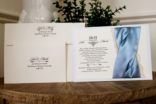 Invitation 1106: Dust Blue, Cream Smooth, Blue Mist Ribbon, Blue Mist Ribbon, Cream Lace - Dust Blue layered invite with a blue mist and lace criss cross twist